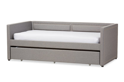 Baxton Studio Raymond Modern and Contemporary Grey Fabric Nail Heads Trimmed Sofa Twin Daybed with Roll-Out Trundle Guest Bed